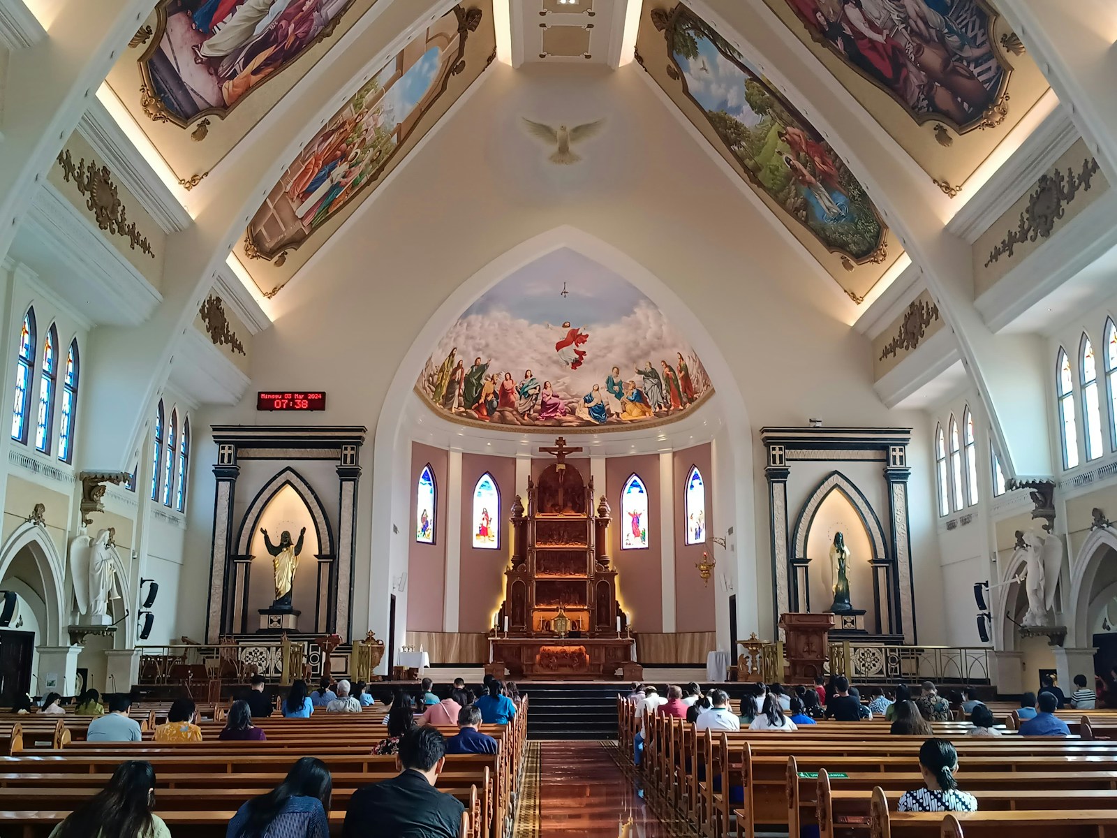 Large congregation gathered for worship inside a church